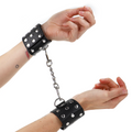 KINK - WRIST RESTRAINT CUFFS WITH SNAP CLOSURE, FULL RIVETS, BLACK, ADJUSTABLE 19-24 CM X 5.5 CM