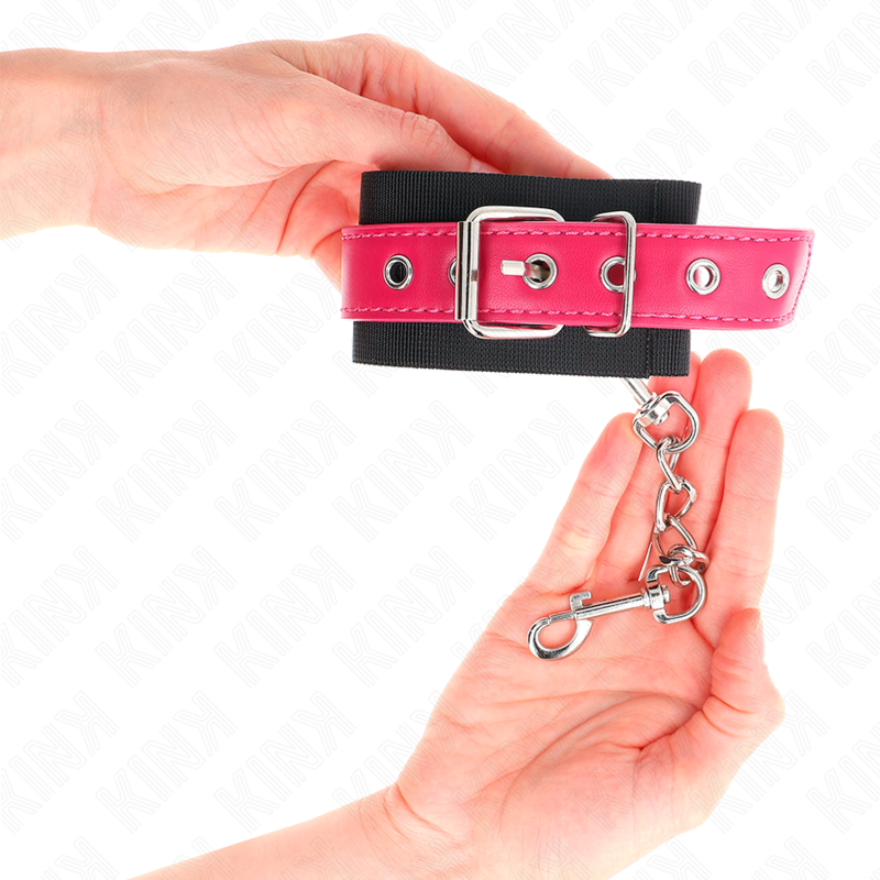 KINK - BLACK NYLON WRIST RESTRAINTS WITH ADJUSTABLE RASPBERRY PINK FAUX LEATHER BELT 19-29 CM X 5.1 CM